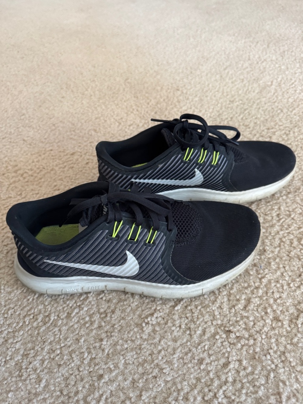 Nike Black Sneakers with White Swoosh and Neon Yellow Accents
